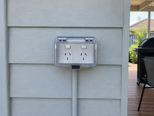 Double outdoor power point with clear cover on a weatherboard exterior wall in Thornton